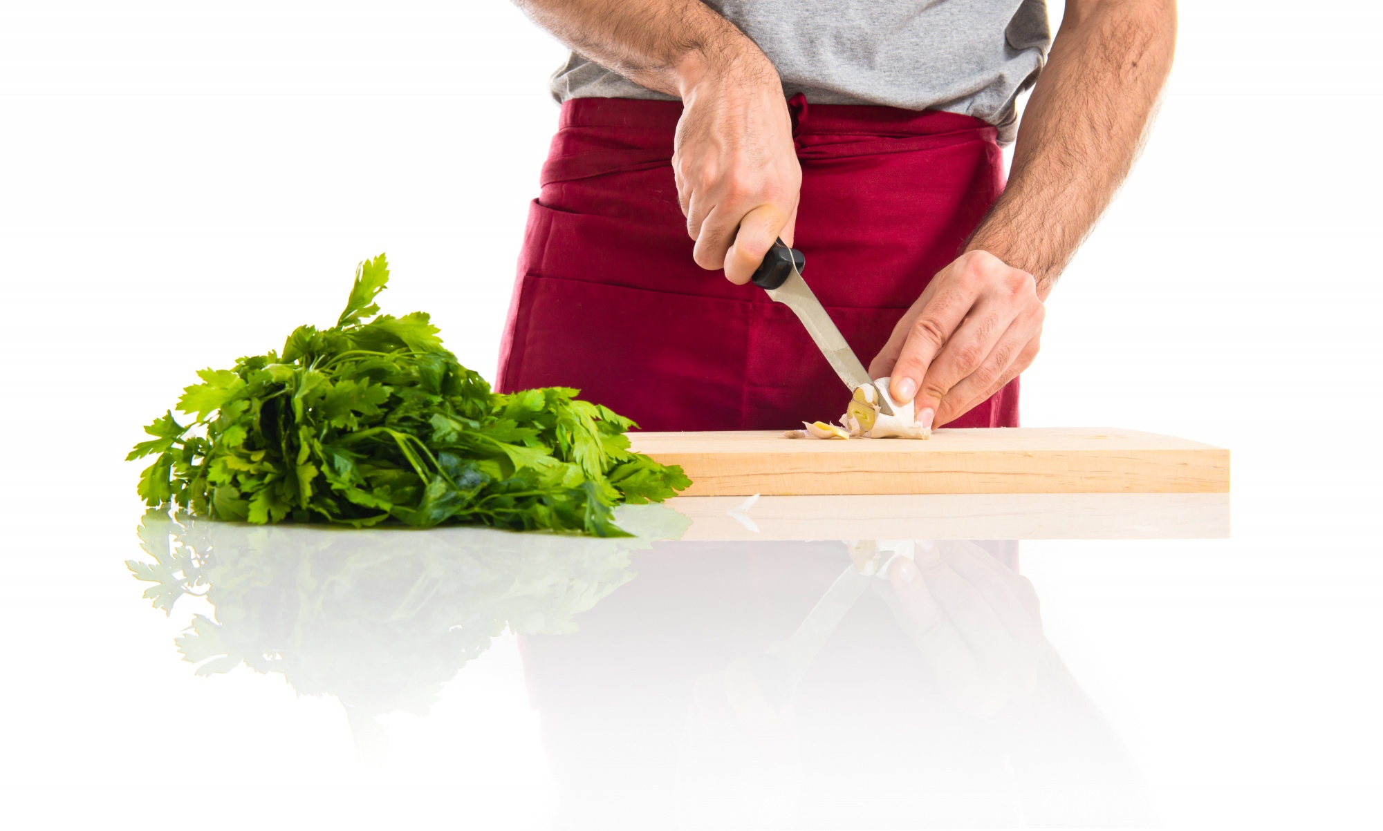 Hands slicing herbs quickly